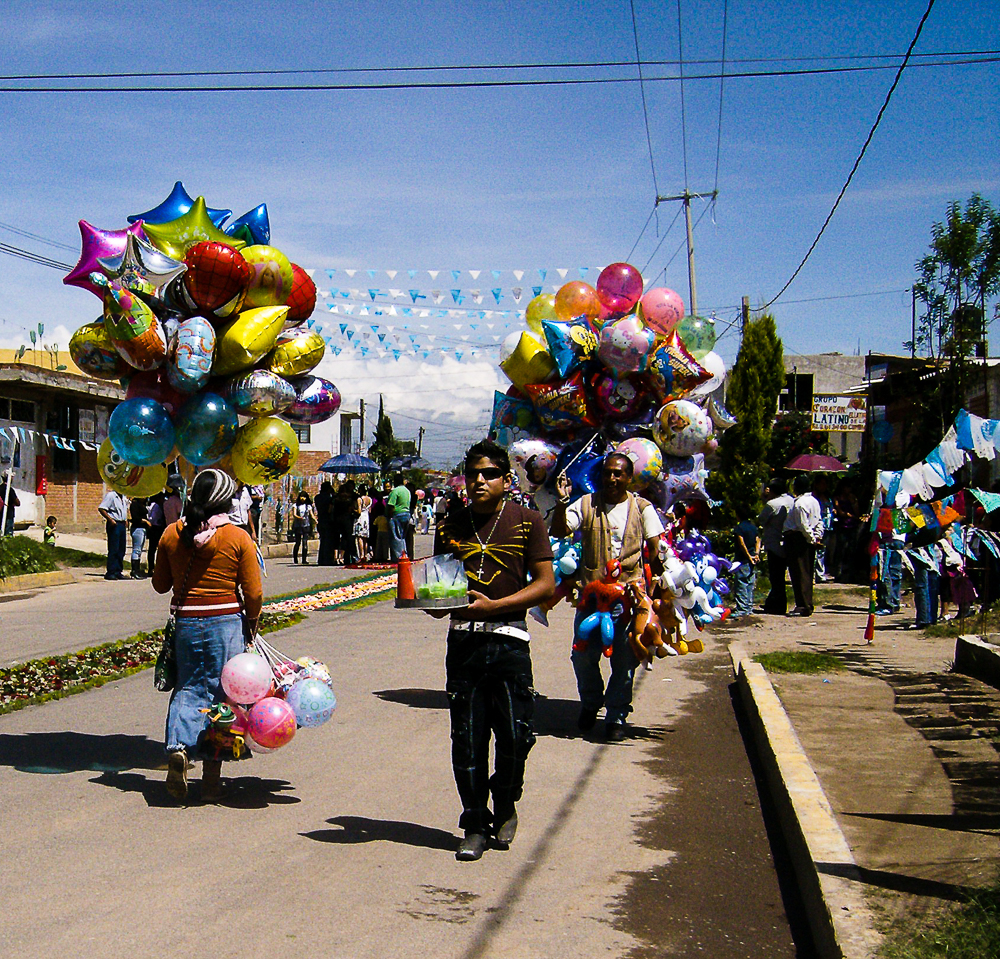Picture of man carrying balloons
